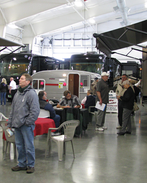 Washington State Evergreen Fall RV Show: Visitors explore the indoor motorhome exhibits in comfort and warmth